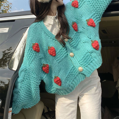 Cardigan en maille torsadée brodée
